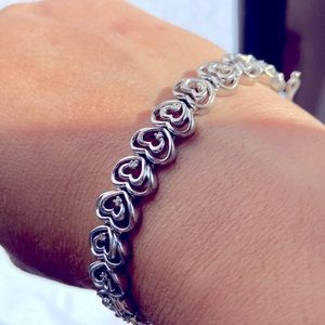 Beautiful gold plated heart link bracelet with genuine diamonds.